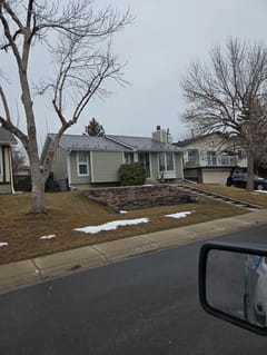 Tudor Brown Interlock Slate aluminum roof on a Tudor brown metal roof on a single-storey home in a, Calgary, Alberta
