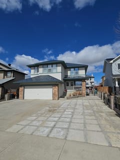 Deep Charcoal Interlock Slate aluminum roof on a Deep Charcoal metal roof on a two-storey Modern home in a, Chestermere, Alberta
