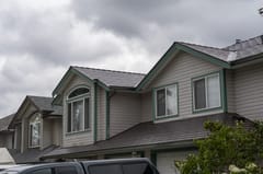 Tudor Brown Interlock Cedar Shingle aluminum roof on a Tudor home with a metal roof in Tudor Brown colour in an, Maple Ridge, British Columbia