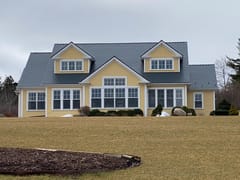 Deep Charcoal Interlock Cedar Shingle aluminum roof on the home, Mahone Bay, Nova Scotia