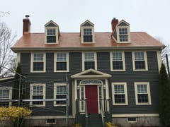 Copper Penny Interlock Slate aluminum roof on the home with chimney, Granville Ferry, Nova Scotia