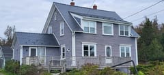 Deep Charcoal Interlock Cedar Shingle aluminum roof on the home, Kingsburg, Nova Scotia