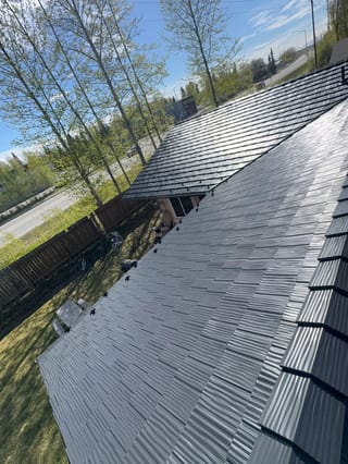 A modern home with a grey metal roof