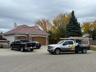 Aged Copper Interlock Shake aluminum roof on a single-storey home with a garage in a suburban, Calgary, Alberta