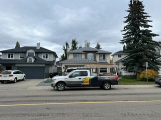 Charcoal Grey Interlock Slate aluminum roof on a two-storey home with a metal roof in a suburban, Calgary, Alberta