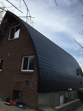 Black Interlock Slate aluminum roof on a brown home with a black metal roof in a rural setting, Whitecourt, Alberta
