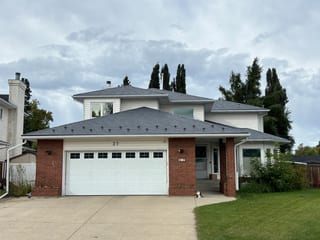 Deep Charcoal Interlock Slate aluminum roof on a two-storey home with a metal roof in Devon, Alberta, Devon, Alberta