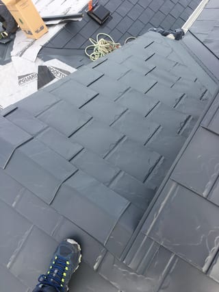 Deep Charcoal Interlock Slate aluminum roof on a two-storey home with a metal roof in Deep Charcoal among, Fort Saskatchewan, Alberta