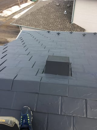 Deep Charcoal Interlock Slate aluminum roof on a large single-family home with a metal roof in Fort, Fort Saskatchewan, Alberta