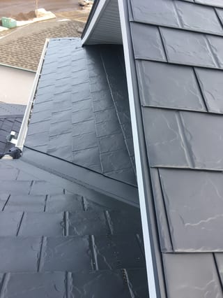 Deep Charcoal Interlock Slate aluminum roof on a house with a deep charcoal metal roof in a rural setting, Fort Saskatchewan, Alberta