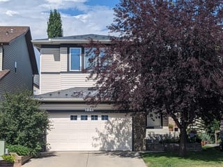 Deep Charcoal Interlock Slate aluminum roof on a two-storey home with a metal roof in Deep Charcoal among, Calgary, Alberta