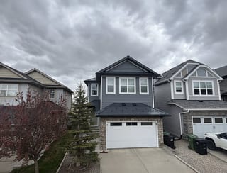 Deep Charcoal Interlock Slate aluminum roof on a two-storey home with dormers in a residential, Calgary, Alberta