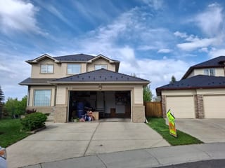 Tudor Brown Interlock Slate aluminum roof on a Tudor home with dormers on a mountain in rural Alberta, Calgary, Alberta