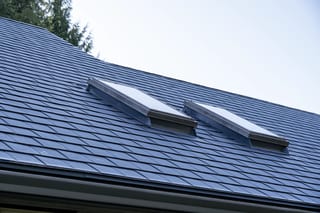 Deep Charcoal Interlock Slate aluminum roof on a Deep Charcoal Interlock Slate metal roof on a house near, Sechelt, British Columbia