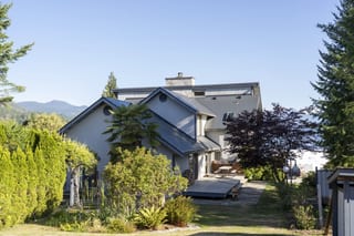 Deep Charcoal Interlock Slate aluminum roof on a modern home with a metal roof under construction in a, Sechelt, British Columbia
