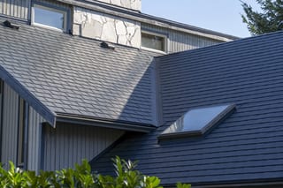 Deep Charcoal Interlock Slate aluminum roof on a modern single-family home with a skylight in a coastal, Sechelt, British Columbia