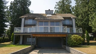 Before: a mossy wood shake roof on the home, Sechelt, British Columbia, ahead of a Deep Charcoal Interlock Slate aluminum roof