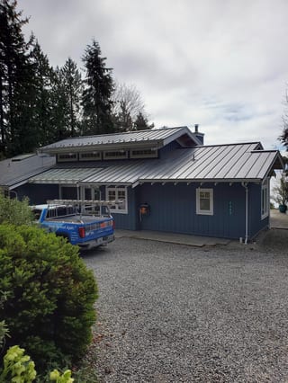 Interlock Aluminum Standing Seam Metal Roofing – Deep Charcoal | Roberts Creek, BC (Front-right elevation)