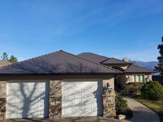 Tudor Brown Interlock Cedar Shingle aluminum roof on a Tudor Brown metal roof on a single-storey modern home in, West Kelowna, British Columbia