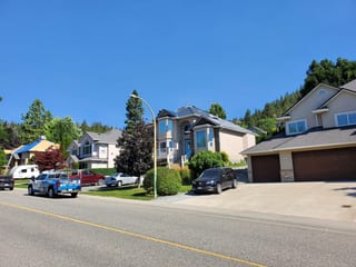 Deep Charcoal Interlock Slate aluminum roof being installed on the home, replacing a worn out asphalt shingle roof, Kelowna, British Columbia