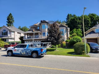 Deep Charcoal Interlock Slate aluminum roof being installed on the home, replacing a worn out asphalt shingle roof, Kelowna, British Columbia