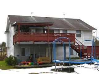 Before: a rotten asphalt shingle roof on the home, Mission, British Columbia, ahead of a Charcoal Grey Interlock Slate aluminum roof