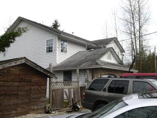 Before: a rotten asphalt shingle roof on the home, Mission, British Columbia, ahead of a Charcoal Grey Interlock Slate aluminum roof