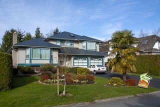 Deep Charcoal Interlock Slate aluminum roof on a single-family home with a metal roof and garage in a, Surrey, British Columbia