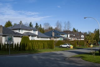 Musket Grey Interlock Slate aluminum roof on a two-storey home with a metal roof in Musket Grey among, Surrey, British Columbia