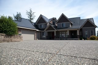 Black Interlock Slate aluminum roof on a dark grey home with two storeys and a gable roof in a, Surrey, British Columbia