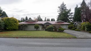 Tile Red Interlock Slate aluminum roof on a ranch style home with a tile red roof in a suburban, Delta, British Columbia