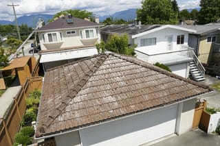 Colonial Brown Interlock Slate aluminum roof being installed on the home, replacing a concrete tile roof with broken tiles, Vancouver, British Columbia
