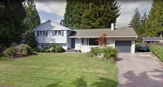 Tudor Brown Interlock Slate aluminum roof on a Tudor style home with brown roof in a suburban, North Vancouver, British Columbia