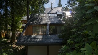Deep Charcoal Interlock Slate aluminum roof on a home with a Deep Charcoal Interlock Slate metal roof in a, Burnaby, British Columbia