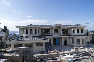 Deep Charcoal Interlock Slate aluminum roof being installed on the home, replacing new construction, West Vancouver, British Columbia
