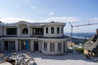 Deep Charcoal Interlock Slate aluminum roof being installed on the home, replacing new construction, West Vancouver, British Columbia
