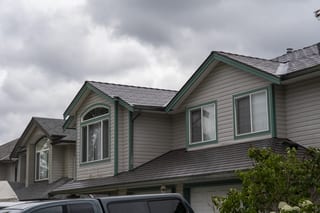 Tudor Brown Interlock Cedar Shingle aluminum roof on a Tudor home with a metal roof in Tudor Brown colour in an, Maple Ridge, British Columbia
