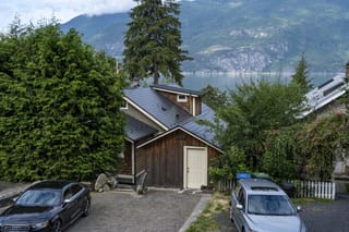 Black Interlock Slate aluminum roof on a brown single-family chalet with a metal roof in a, Britannia Beach, British Columbia