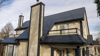 Deep Charcoal Interlock Slate aluminum roof on a beige single-storey craftsman home with a balcony among, Vancouver, British Columbia