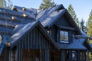Musket Grey Interlock Slate aluminum roof being installed on the home, replacing a worn out asphalt shingle roof, Abbotsford, British Columbia