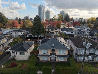 Deep Charcoal Interlock Slate aluminum roof on a two-storey modern home with a metal roof in Burnaby, BC, Burnaby, British Columbia