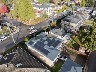 Deep Charcoal Interlock Slate aluminum roof on a single-storey home with a metal roof in a residential area, Burnaby, British Columbia