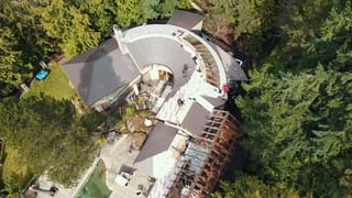 Interlock aluminum Tudor Brown slate metal roof on a West Vancouver, BC home, engineered for the region's wind, snow, rain, and falling branches.