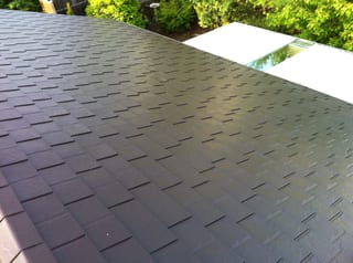 Colonial Brown Interlock Slate aluminum roof on a Colonial home with a Colonial Brown metal roof in, Campbell River, British Columbia