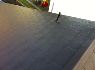Colonial Brown Interlock Slate aluminum roof on a Colonial Brown metal roof on a two-storey home in a, Campbell River, British Columbia