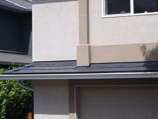 Deep Charcoal Interlock Slate aluminum roof on a modern home with a metal roof in progress in a suburban, Victoria, British Columbia