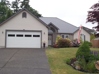 Deep Charcoal Interlock Slate aluminum roof on a ranch style home with a metal roof in Qualicum Beach, BC, Qualicum Beach, British Columbia