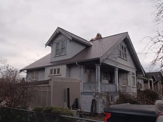 Tudor Brown Interlock Cedar Shingle aluminum roof on a Tudor home with a metal roof in an urban setting, Victoria, British Columbia