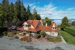 Copper Penny Interlock Slate aluminum roof on a two-storey home with a copper penny metal roof in a, Ladysmith, British Columbia