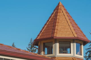 Copper Penny Interlock Slate aluminum roof on a brown single-family home with a copper penny metal roof, Ladysmith, British Columbia